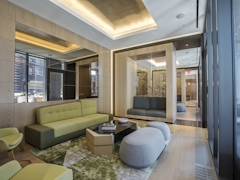 Thumbnail of The Ashland: PH2D a living room filled with furniture and a large window