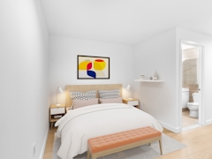 Thumbnail of Gotham West: 531 a bedroom with a bed and desk in a room