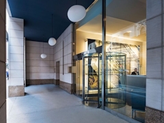 Thumbnail of Atlas New York: 22D a large building with a store on the floor