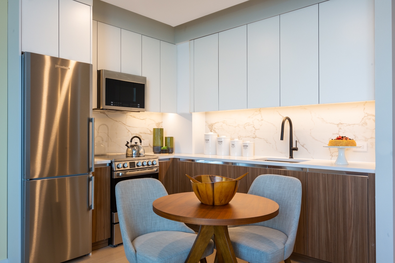 a kitchen with a sink and a window